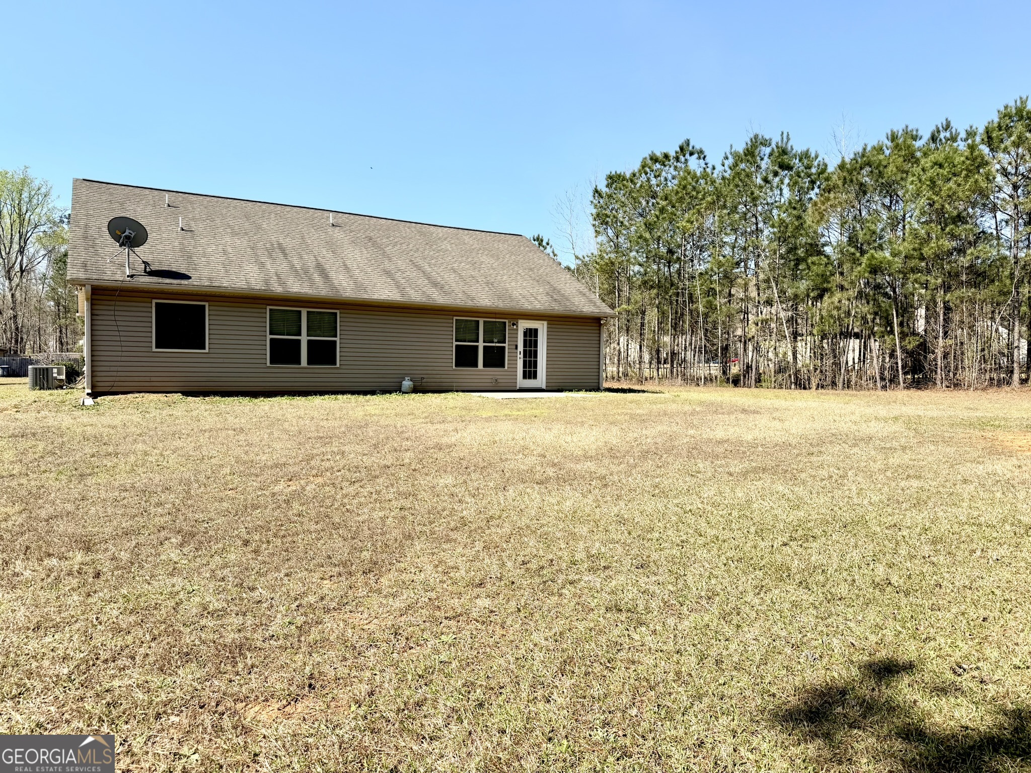 111 Bridle Path Griffin, GA 30224 - Photo 3 of 20 a front view of house with yard and trees in the background