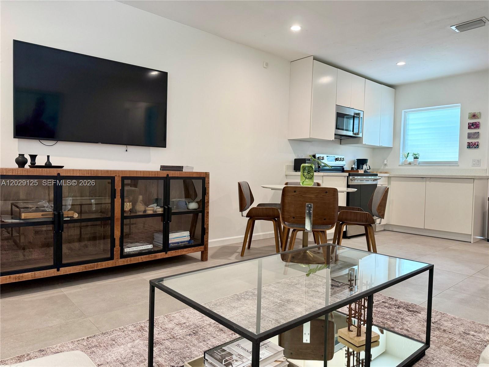 547 Northeast 64th Street, Unit 2 Miami, FL 33138 - Photo 12 of 14 Living Area and Dining Area