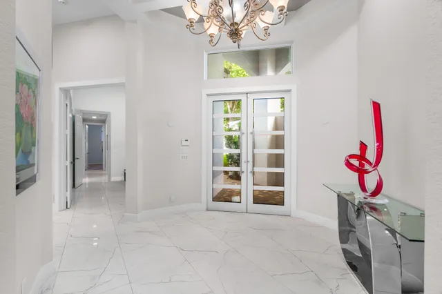 a view of an entryway with a chandelier