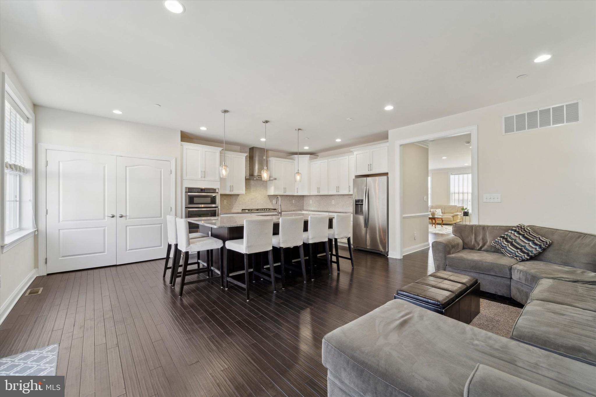 311 Corvus Circle Springfield, PA 19064 - Photo 11 of 51 a living room with furniture dining table and wooden floor
