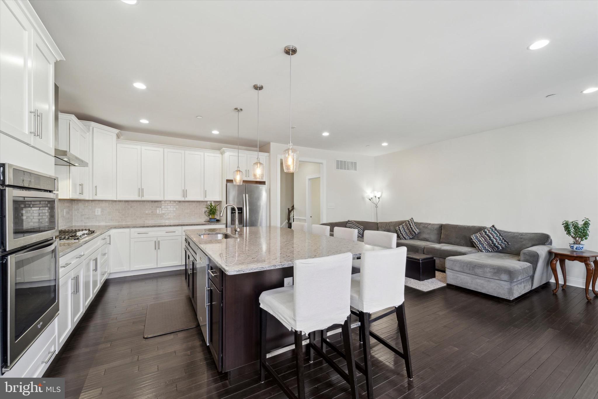 311 Corvus Circle Springfield, PA 19064 - Photo 14 of 51 a large white kitchen with a table and chairs