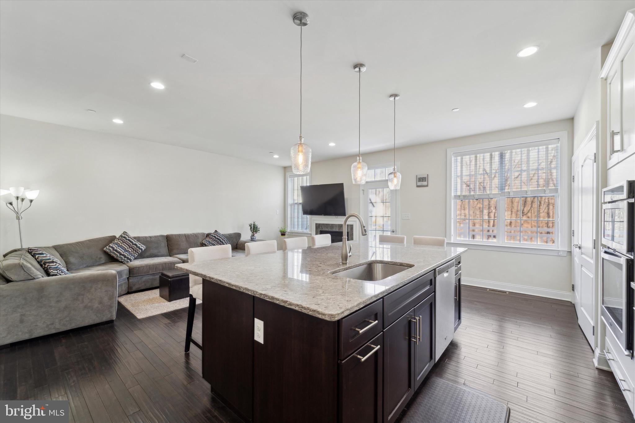 311 Corvus Circle Springfield, PA 19064 - Photo 15 of 51 a open kitchen with stainless steel appliances granite countertop a sink and a refrigerator