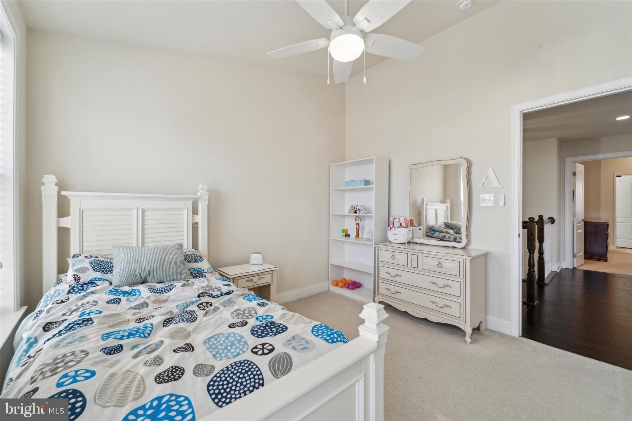 311 Corvus Circle Springfield, PA 19064 - Photo 29 of 51 a bedroom with a bed and a chandelier