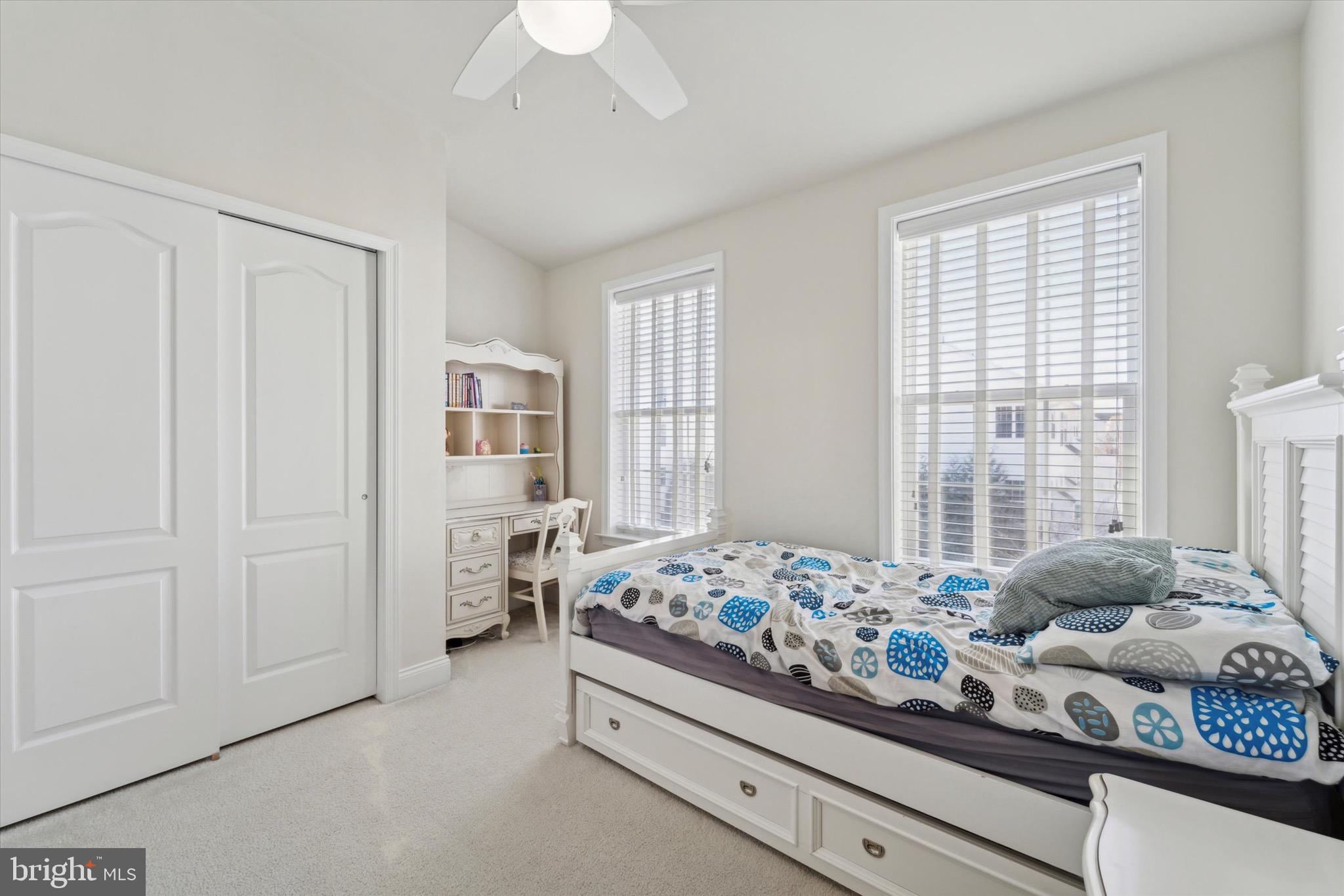 311 Corvus Circle Springfield, PA 19064 - Photo 30 of 51 a bedroom with a bed and large windows