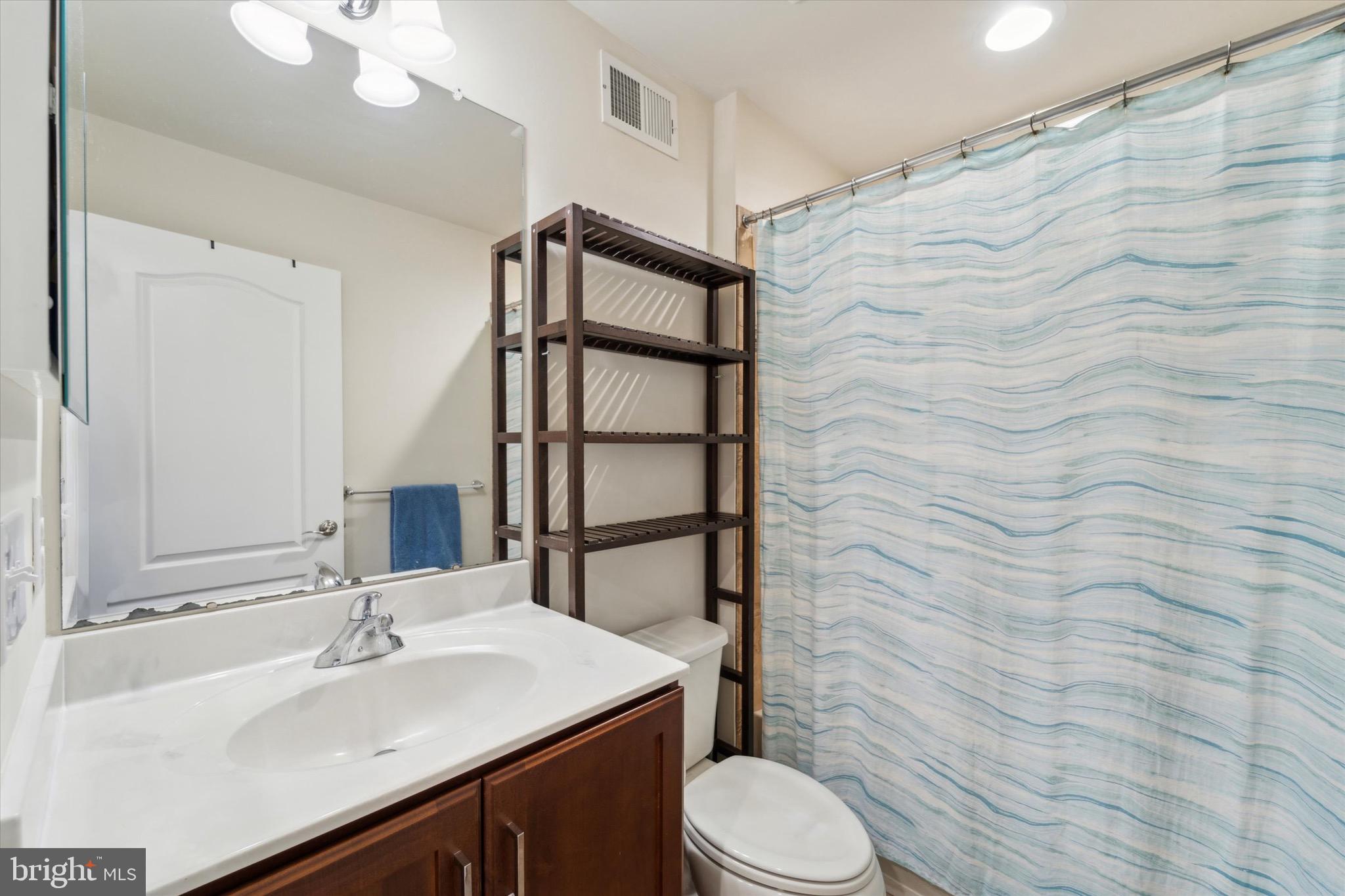 311 Corvus Circle Springfield, PA 19064 - Photo 34 of 51 a bathroom with a sink a toilet and shower curtain