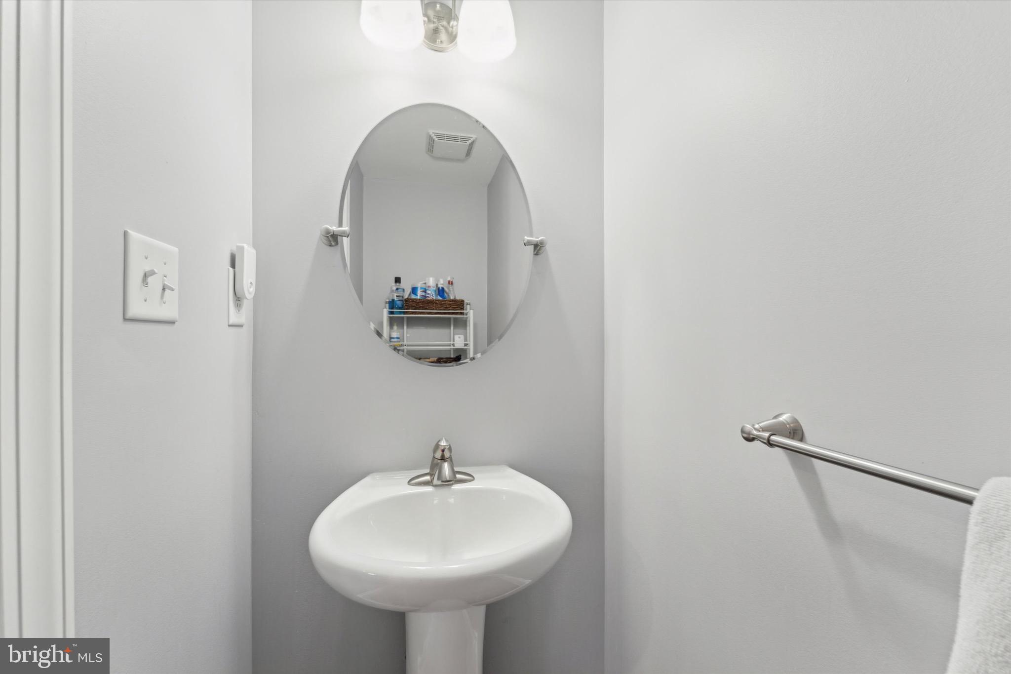311 Corvus Circle Springfield, PA 19064 - Photo 37 of 51 a bathroom with a sink and a mirror