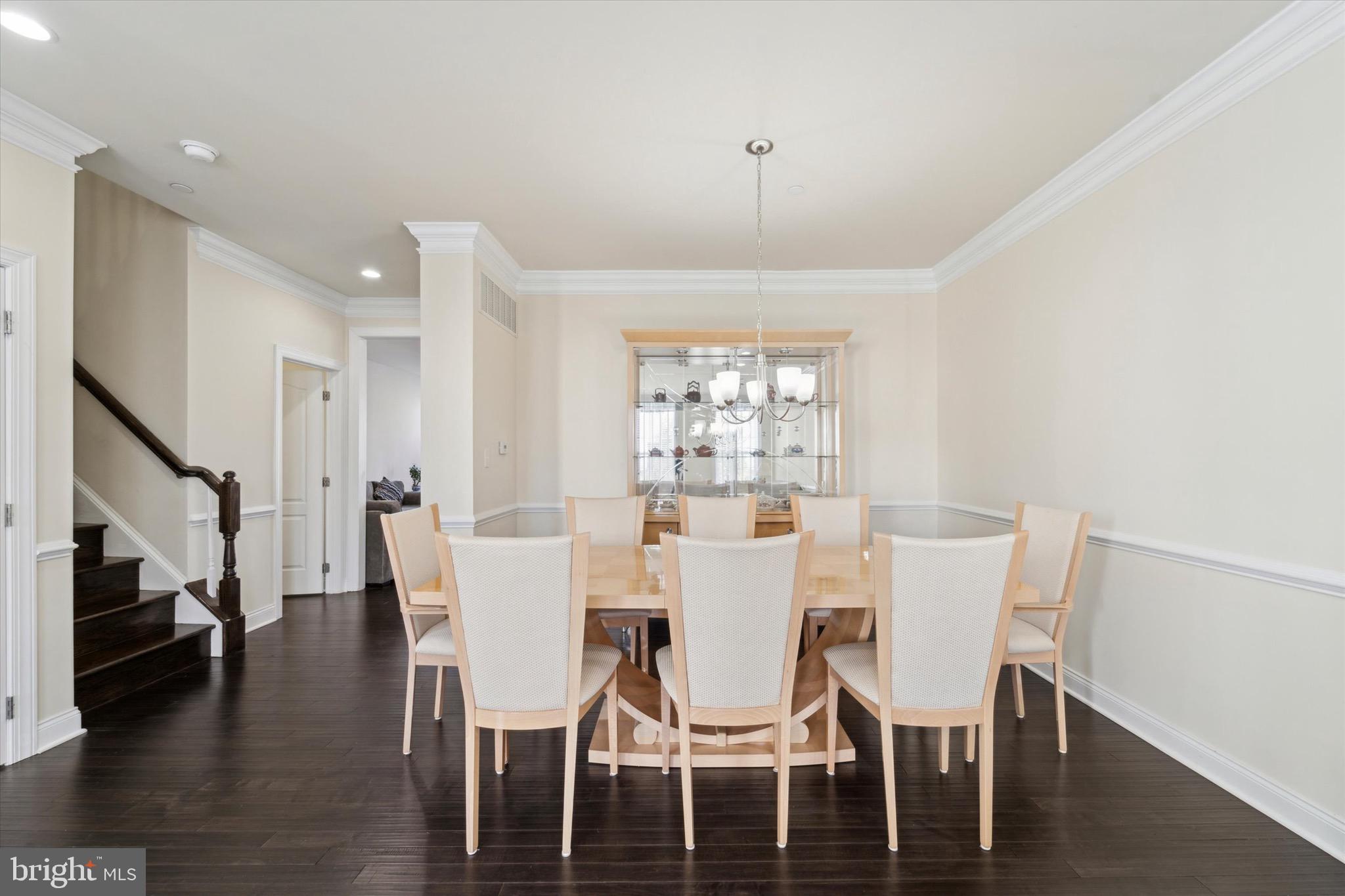 311 Corvus Circle Springfield, PA 19064 - Photo 6 of 51 a view of a dining room with furniture a chandelier and wooden floor