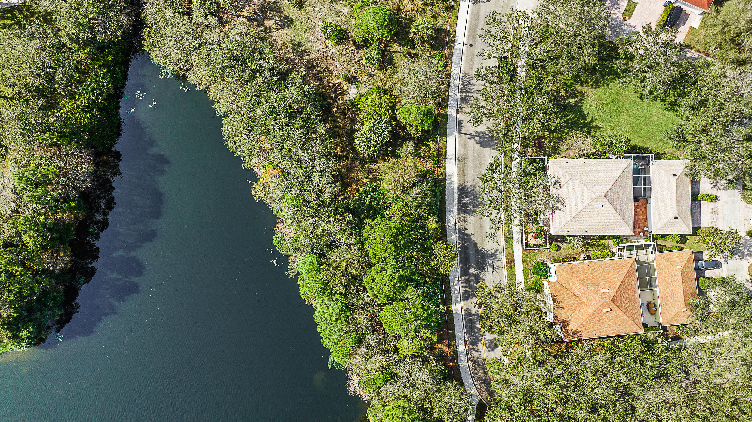 149 Andover Drive Jupiter, FL 33458 - Photo 3 of 3 an aerial view of residential house with outdoor space and trees all around