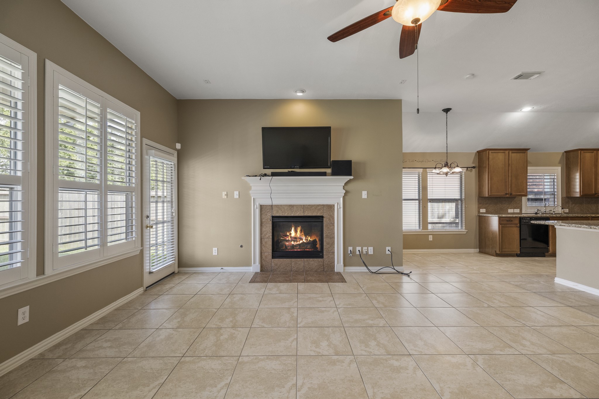 20014 Queens Oak Court Spring, TX 77379 - Photo 9 of 49 a living room with stainless steel appliances furniture a fireplace and a flat screen tv