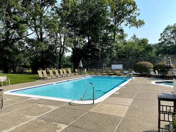 a view of a swimming pool with a patio