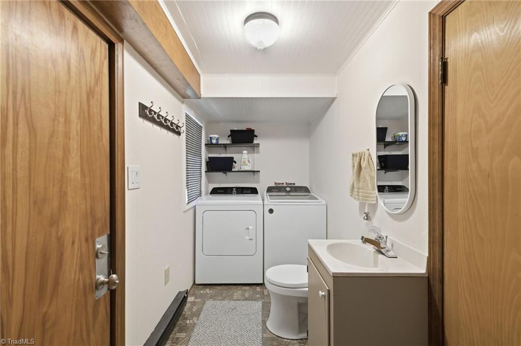 205 Frederick Road Greensboro, NC 27455 - Photo 31 of 49 laundry / half bath- near garage - lower level