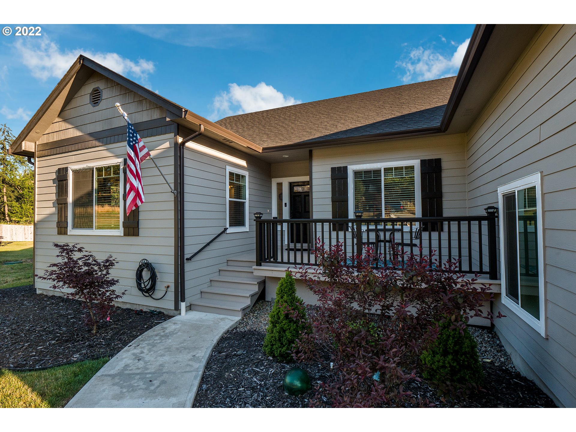 203 Ash Street Springfield, OR 97477 - Photo 21 of 32 a front view of a house with garden