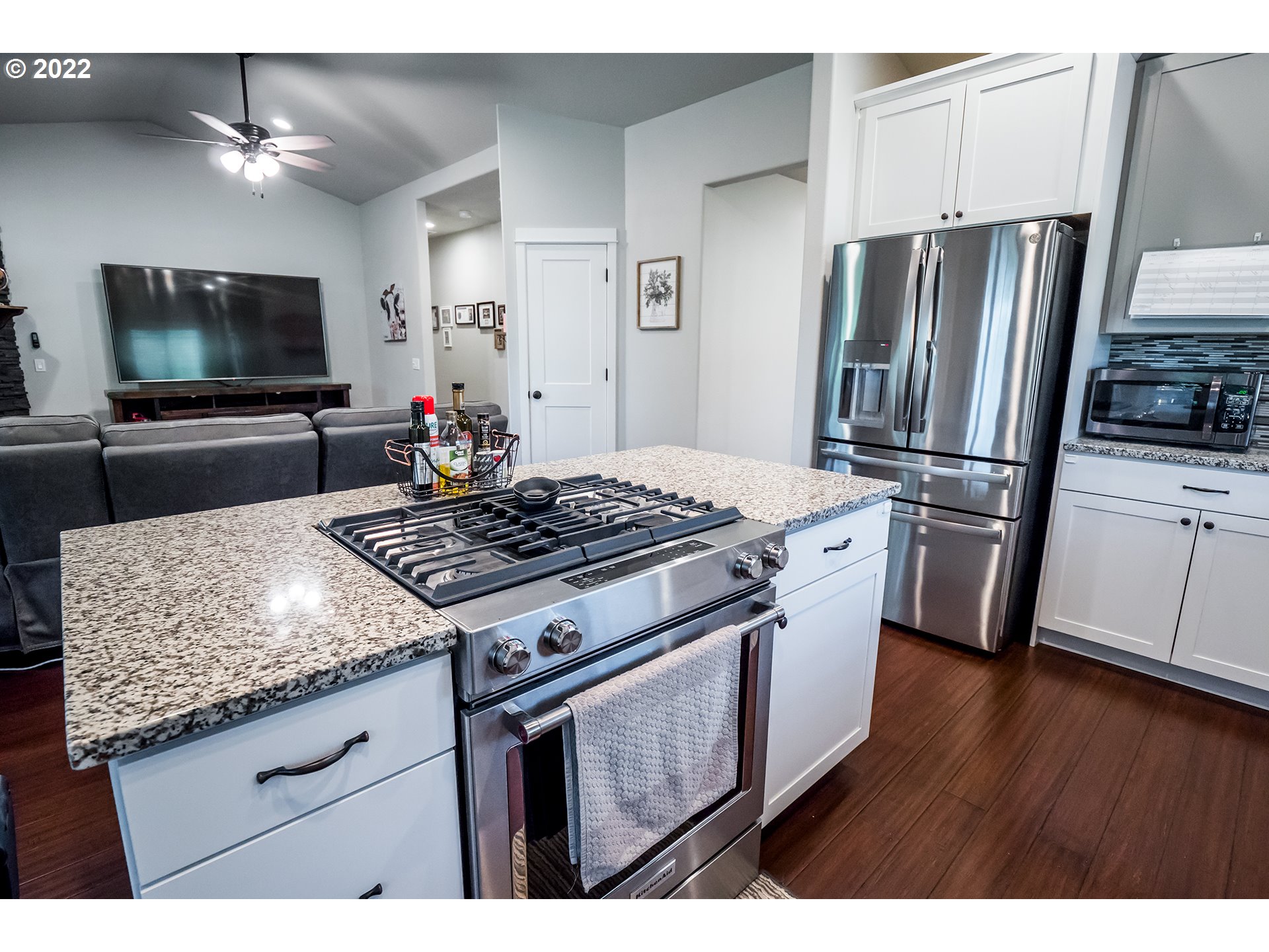 203 Ash Street Springfield, OR 97477 - Photo 5 of 32 a kitchen with a stove and a microwave