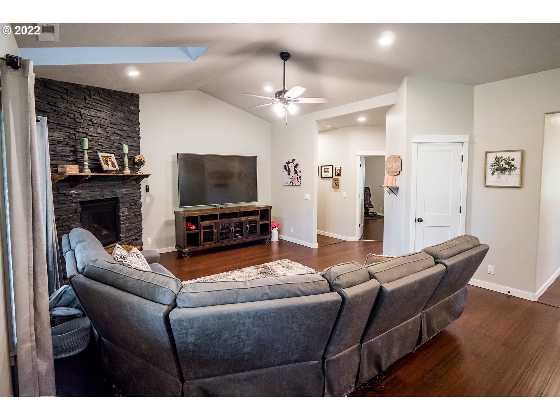 203 Ash Street Springfield, OR 97477 - Photo 7 of 32 a living room with furniture and a flat screen tv