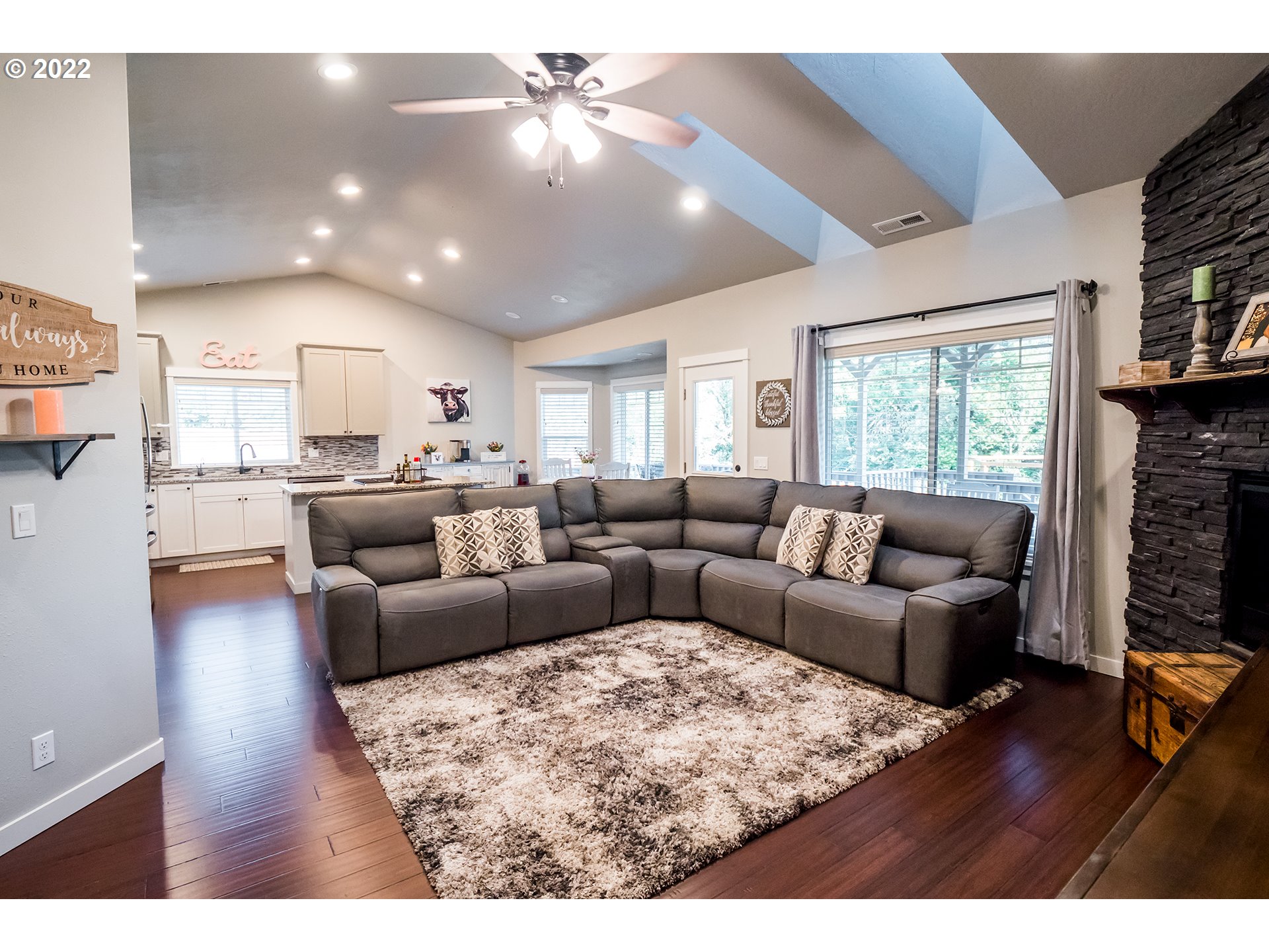 203 Ash Street Springfield, OR 97477 - Photo 8 of 32 a living room with furniture and a fireplace