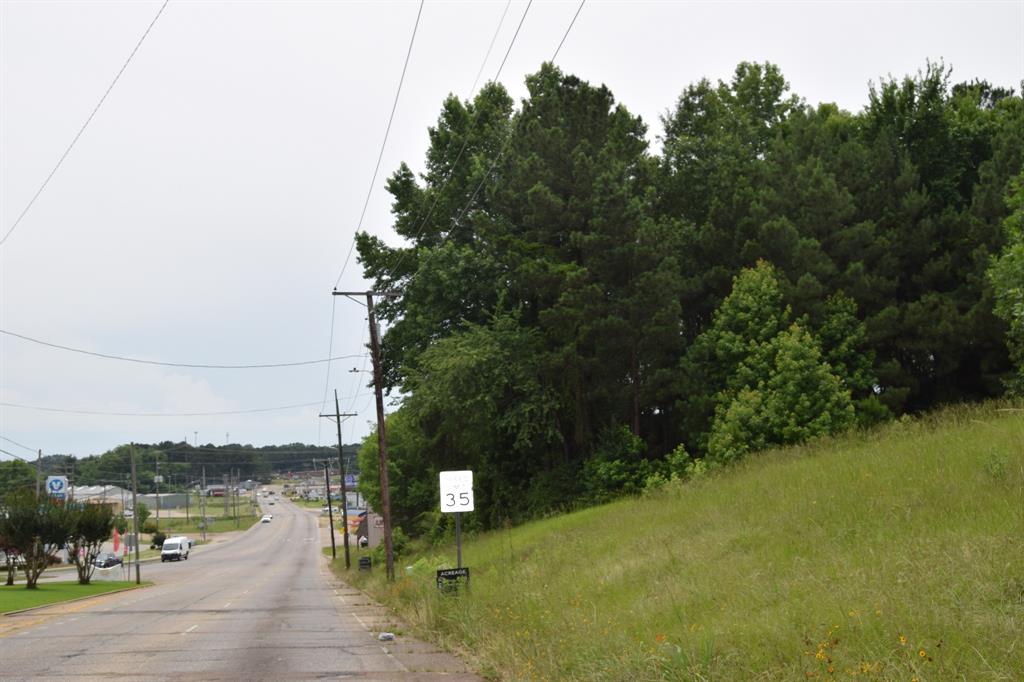 1 Main Street Minden, LA 71055 - Photo 3 of 6 a view of a lake with a mountain in the background