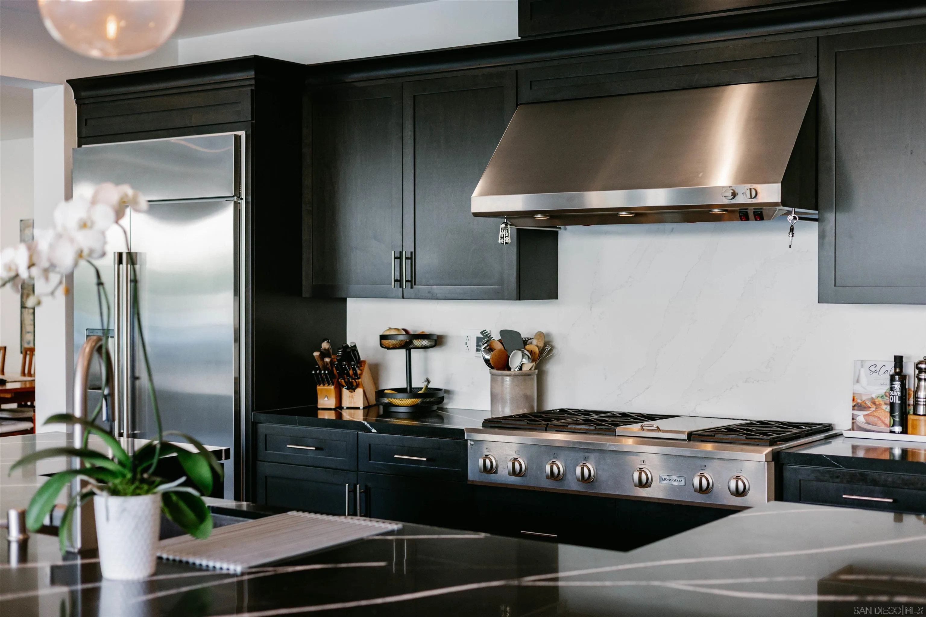927 Moonstone Court Encinitas, CA 92024 - Photo 13 of 31 a kitchen with a stove and a refrigerator