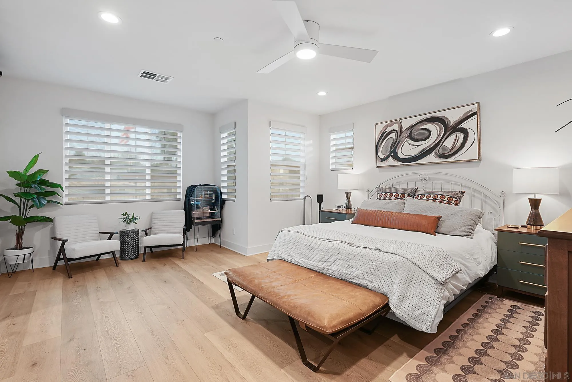 927 Moonstone Court Encinitas, CA 92024 - Photo 21 of 31 a bedroom with a bed and wooden floor