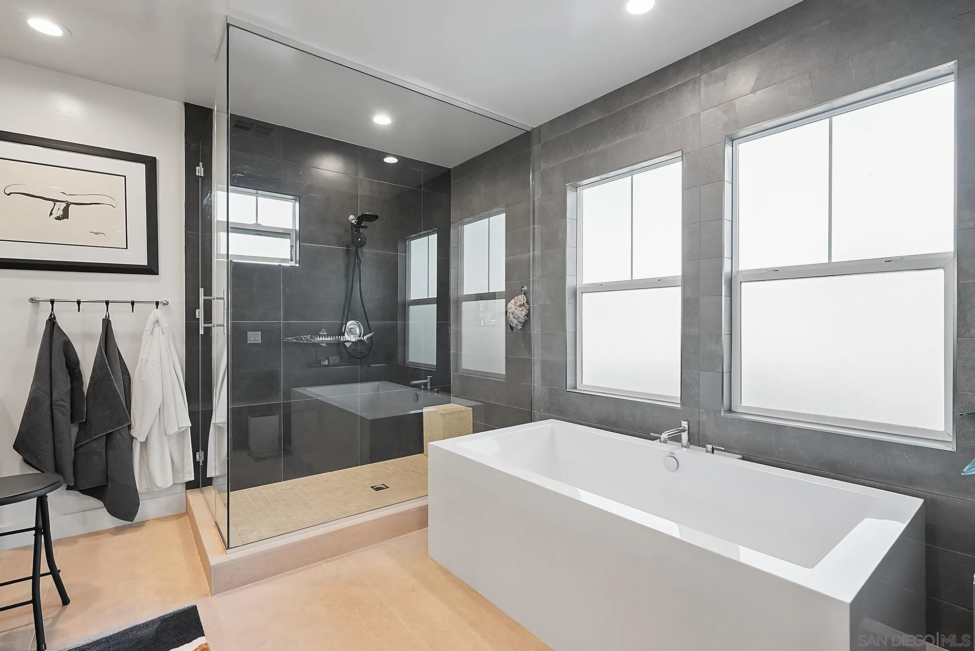 927 Moonstone Court Encinitas, CA 92024 - Photo 24 of 31 a bathroom with a bathtub and a shower