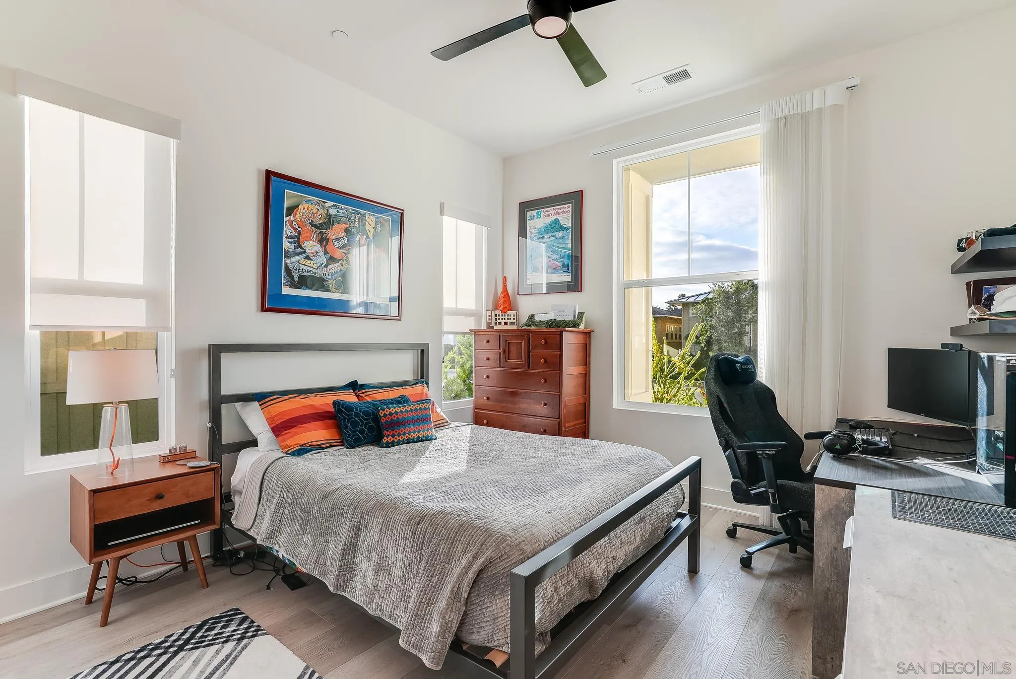 927 Moonstone Court Encinitas, CA 92024 - Photo 26 of 31 a bedroom with a bed and a desk