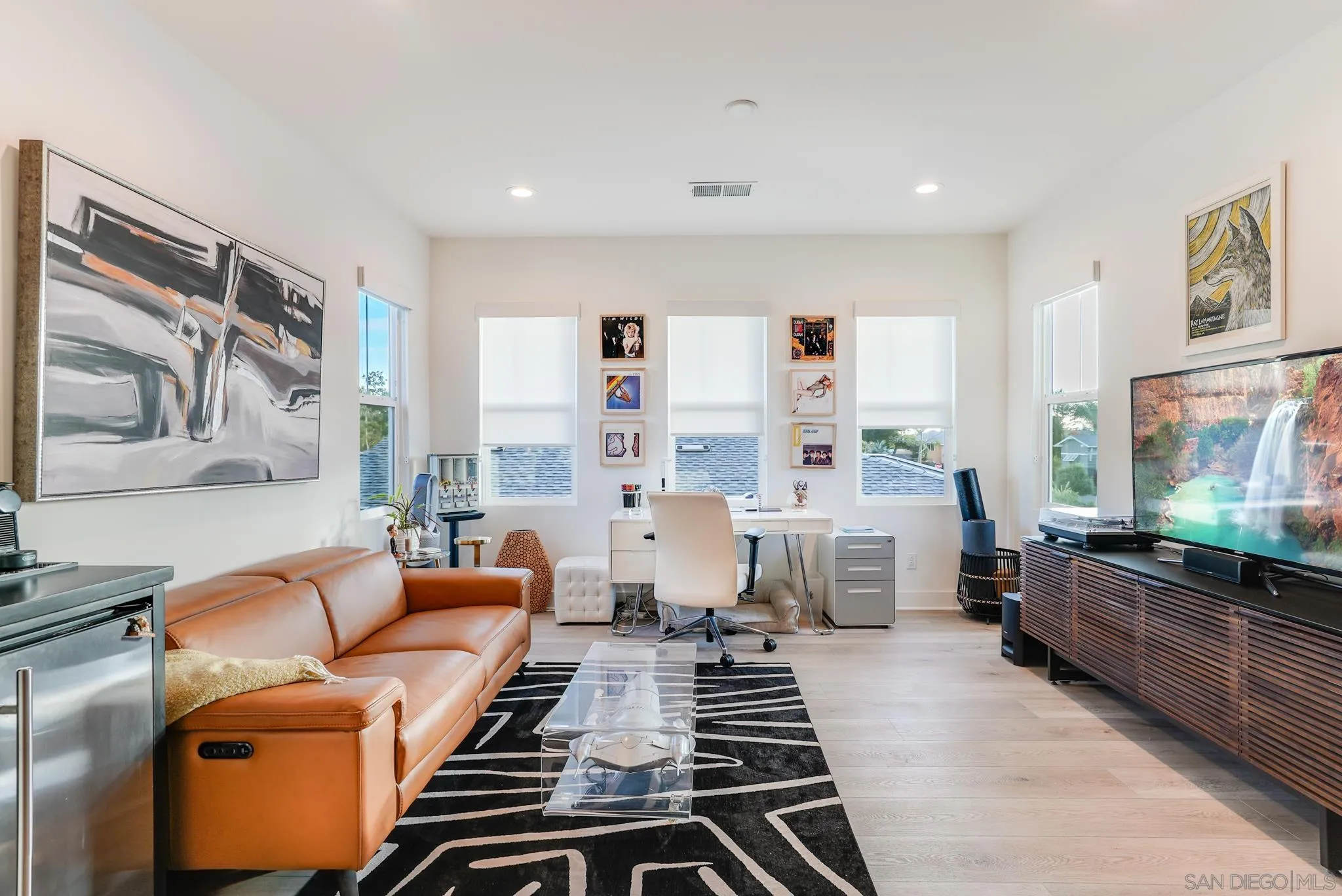 927 Moonstone Court Encinitas, CA 92024 - Photo 27 of 31 a living room with furniture and a flat screen tv
