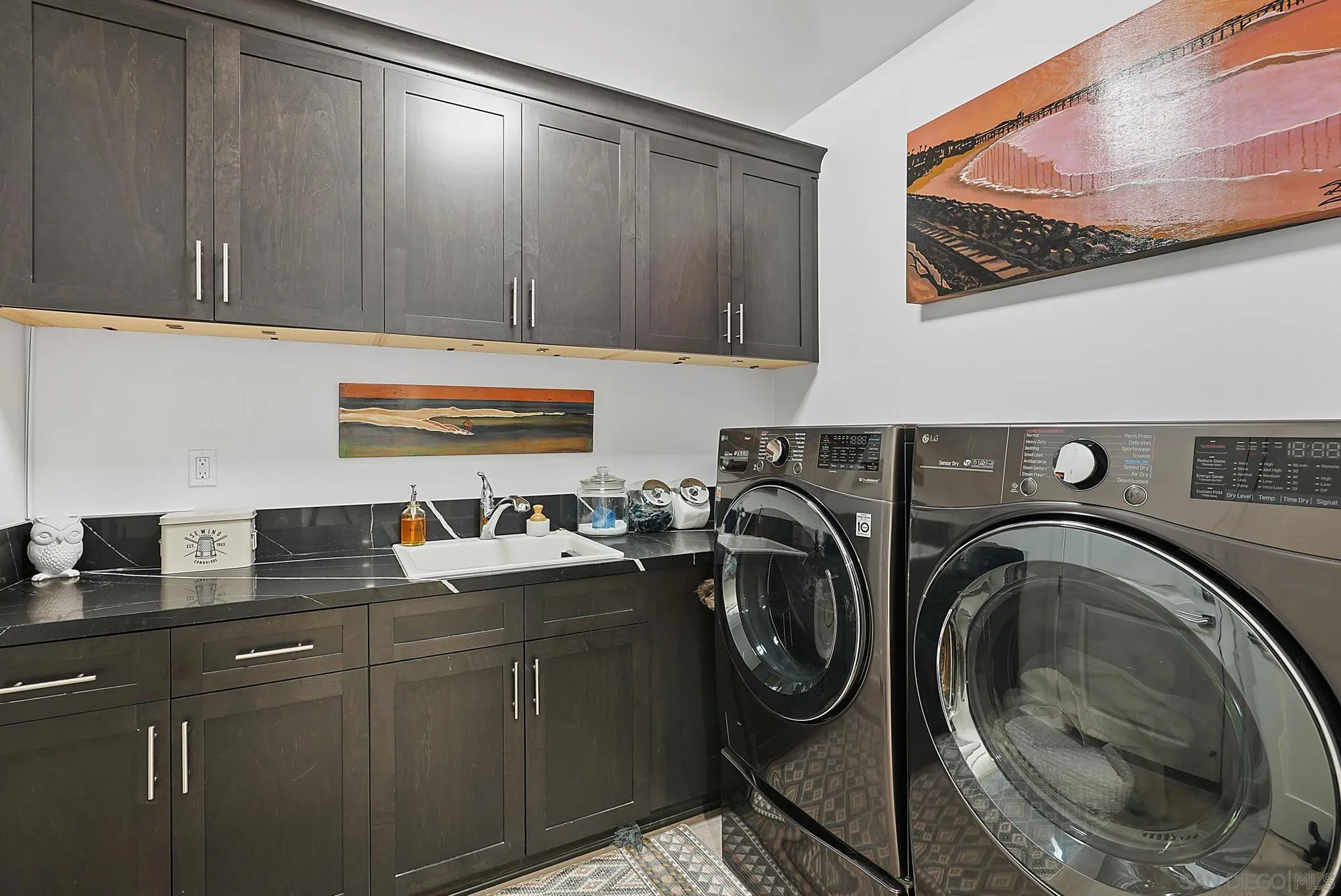 927 Moonstone Court Encinitas, CA 92024 - Photo 31 of 31 a utility room with sink dryer and washer