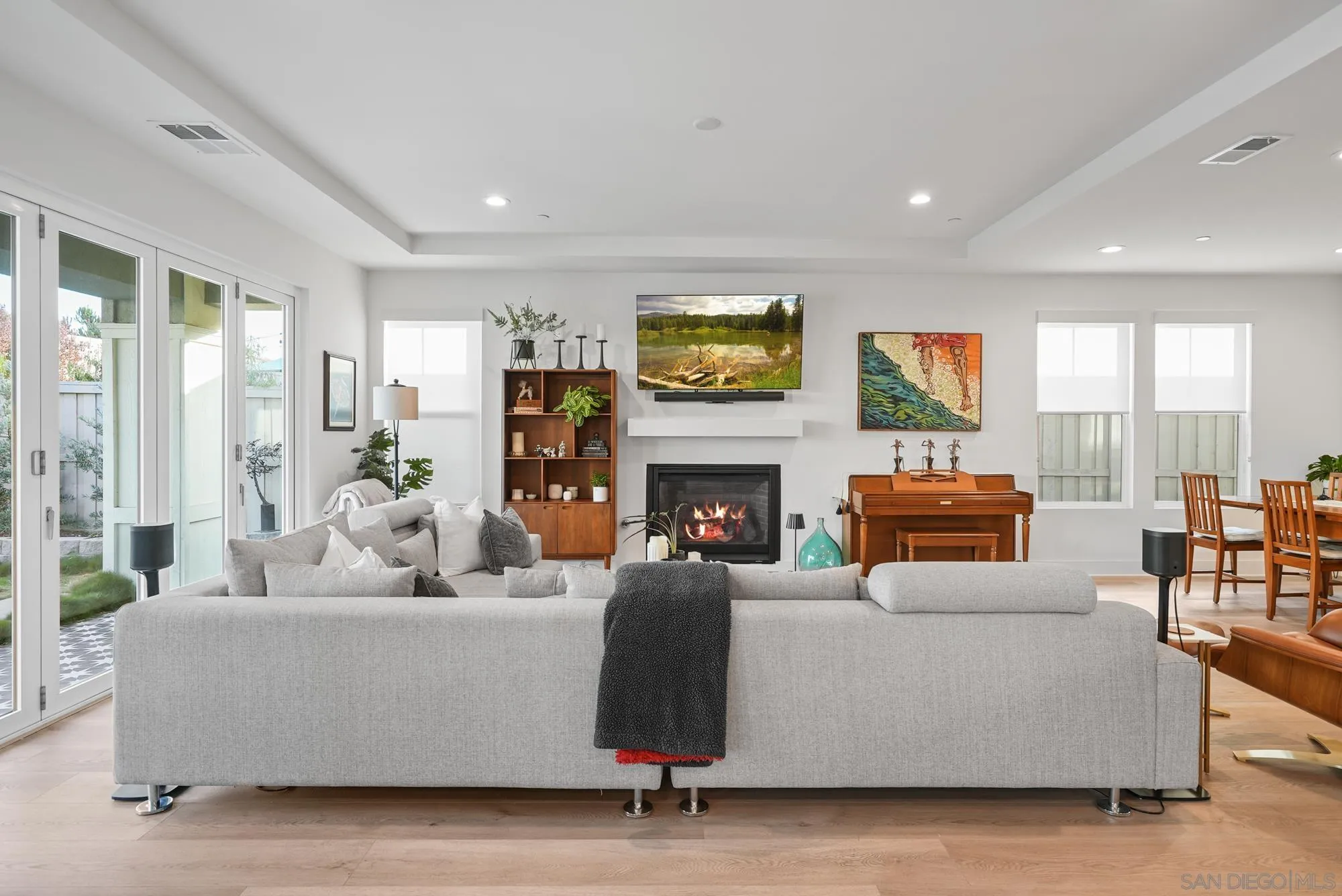 927 Moonstone Court Encinitas, CA 92024 - Photo 5 of 31 a living room with furniture and a fireplace