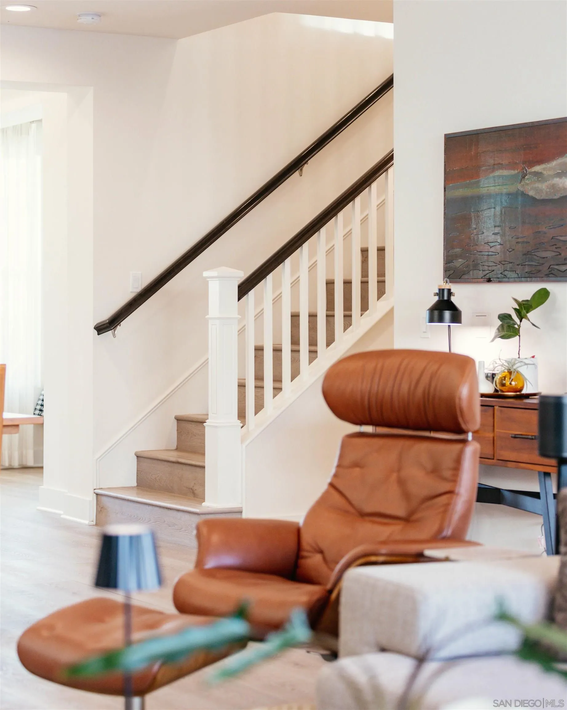 927 Moonstone Court Encinitas, CA 92024 - Photo 8 of 31 a living room with furniture and a potted plant