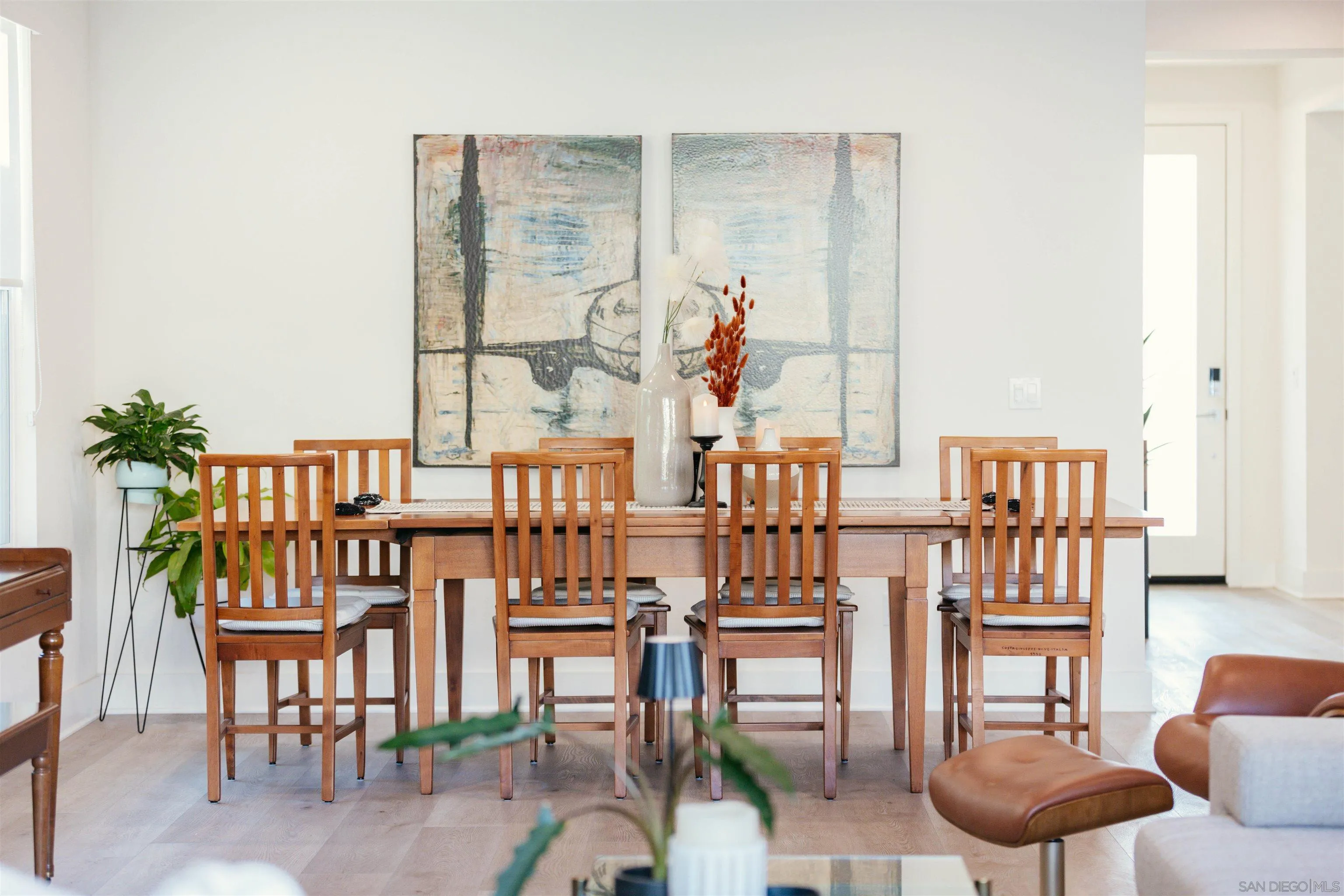 927 Moonstone Court Encinitas, CA 92024 - Photo 9 of 31 a dining room with furniture and a floor to ceiling window