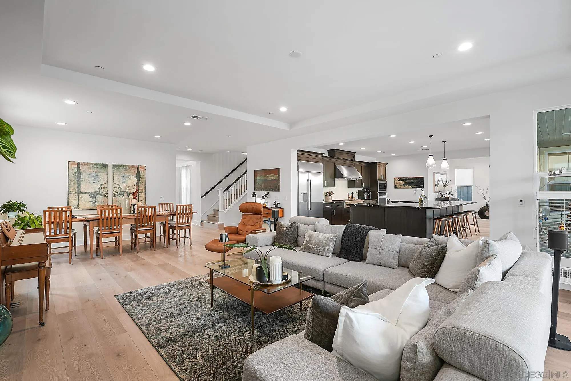 927 Moonstone Court Encinitas, CA 92024 - Photo 10 of 31 a living room with furniture kitchen view and a dining table
