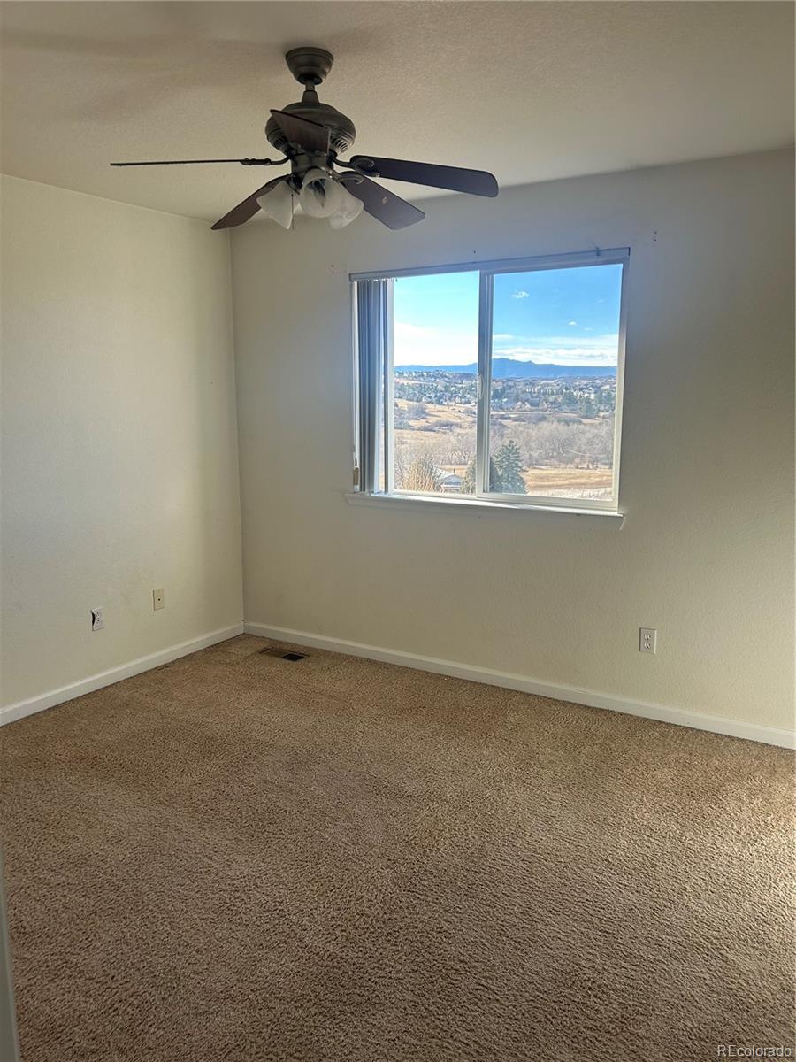 1497 Willow Oak Road Castle Rock, CO 80104 - Photo 21 of 28 a view of an empty room with a window