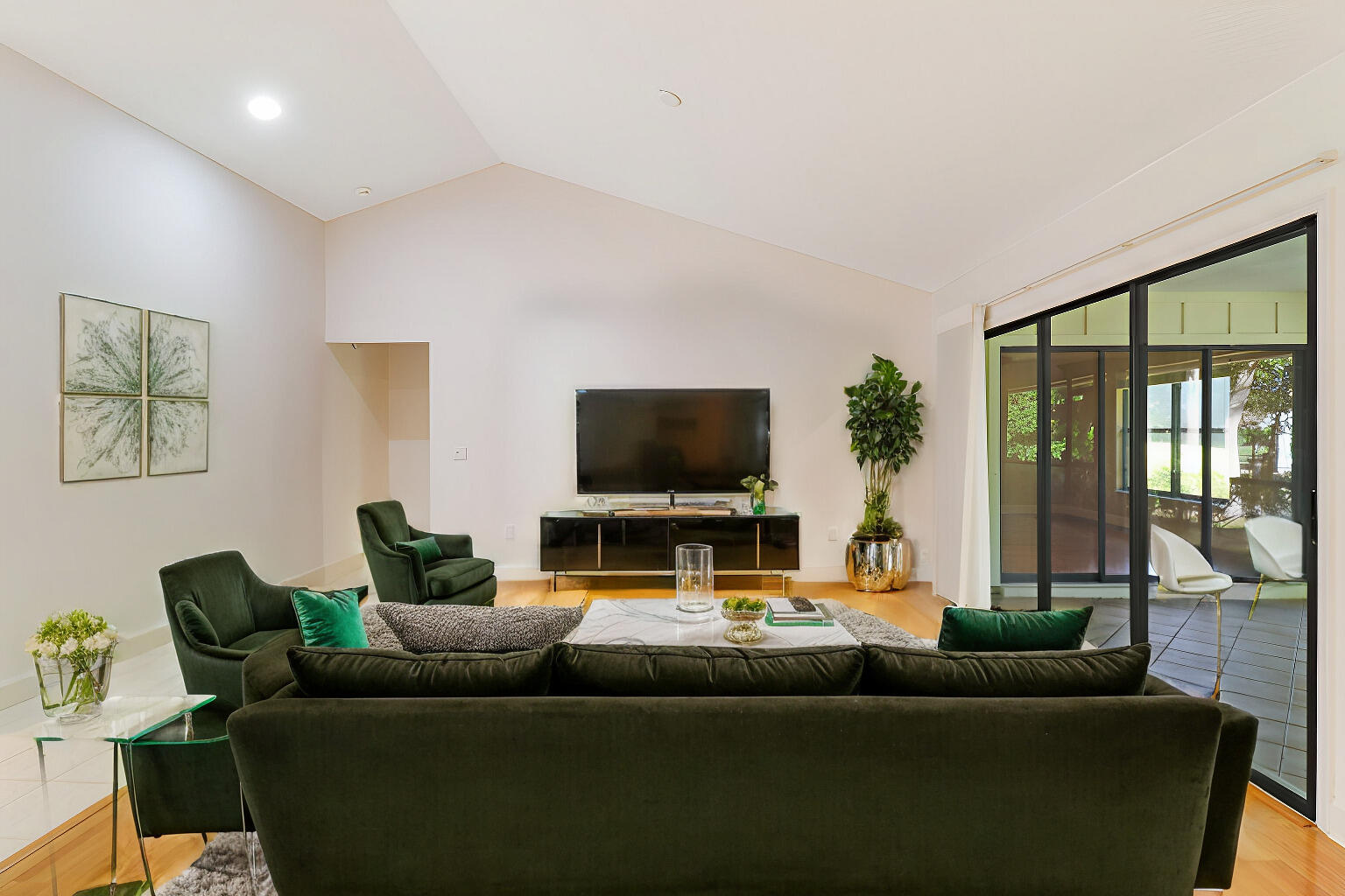 6239 Longleaf Pine Drive Jupiter, FL 33458 - Photo 2 of 36 a living room with furniture and a flat screen tv