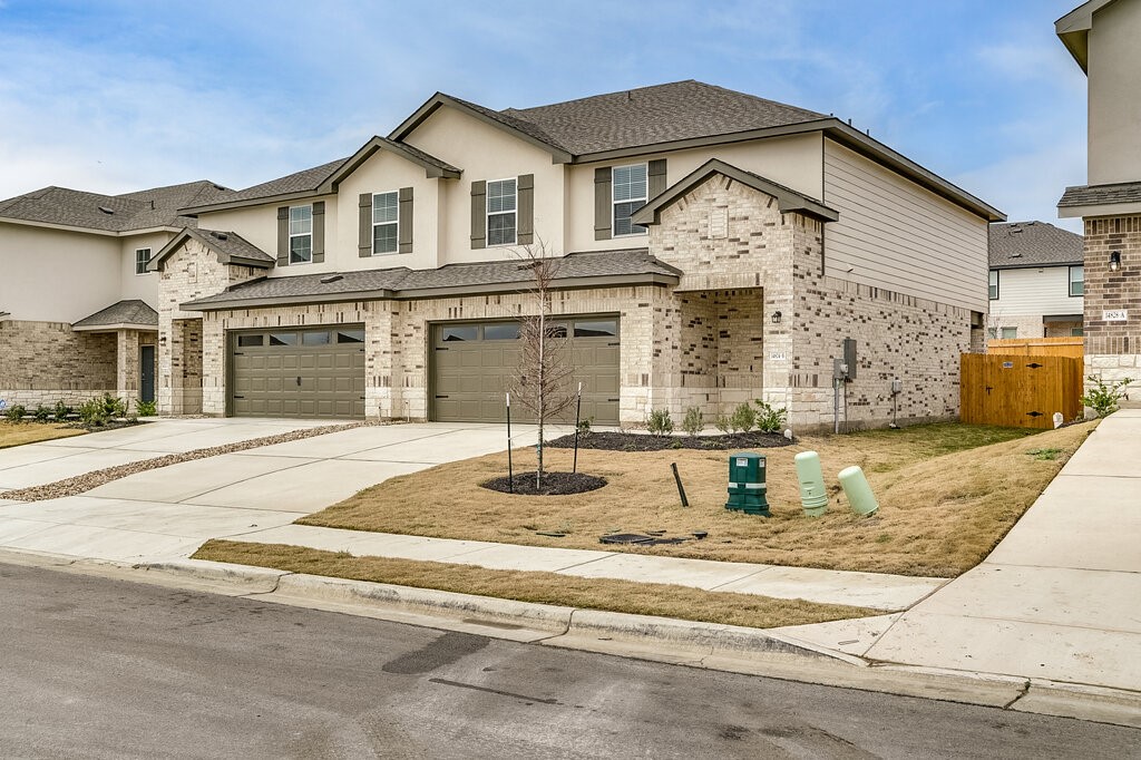 a front view of a house with a yard