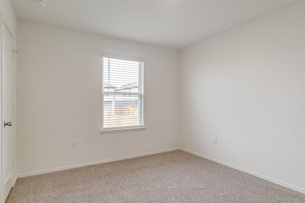 14824 Grey Ghost Way, Unit A Manor, TX 78653 - Photo 15 of 20 an empty room with a window