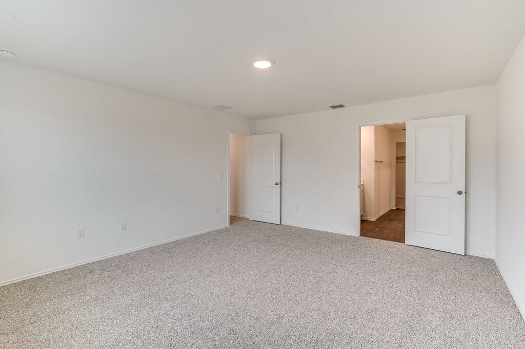 14824 Grey Ghost Way, Unit A Manor, TX 78653 - Photo 17 of 20 a view of an empty room