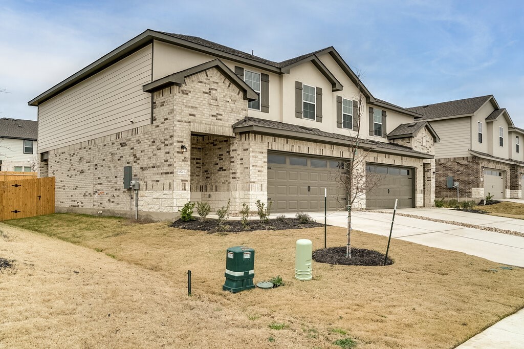 14824 Grey Ghost Way, Unit A Manor, TX 78653 - Photo 2 of 20 a view of a house with a patio