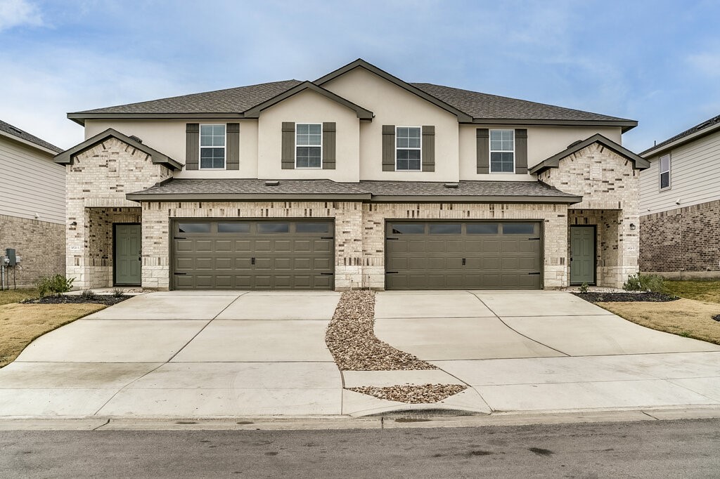 14824 Grey Ghost Way, Unit A Manor, TX 78653 - Photo 3 of 20 front view of a house
