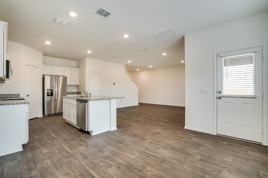 14824 Grey Ghost Way, Unit A Manor, TX 78653 - Photo 6 of 20 a view of kitchen with wooden floor