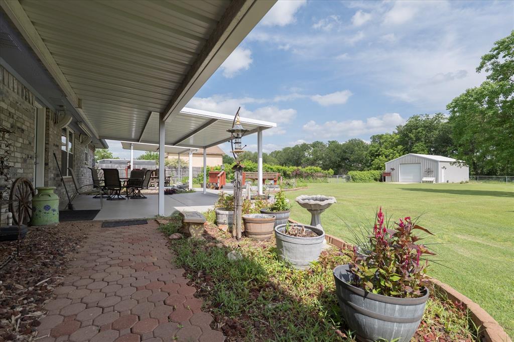 107 Fort Graham Circle Waco, TX 76705 - Photo 7 of 39 Expansive covered patio with a paved walkway