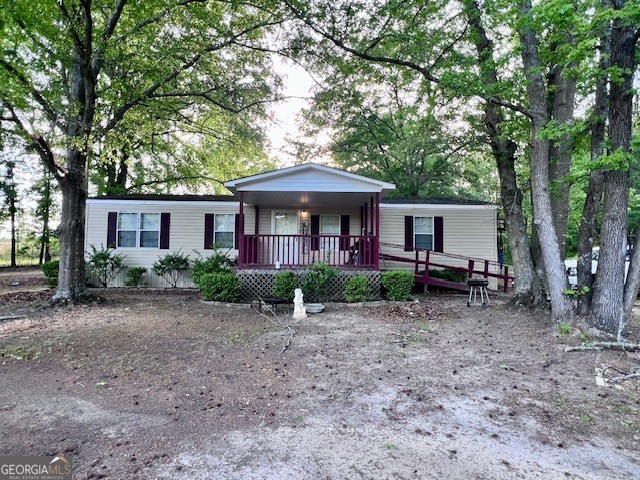 3195 Henderson Grove Road Sandersville, GA 31082 - Photo 1 of 50 a front view of a house with yard