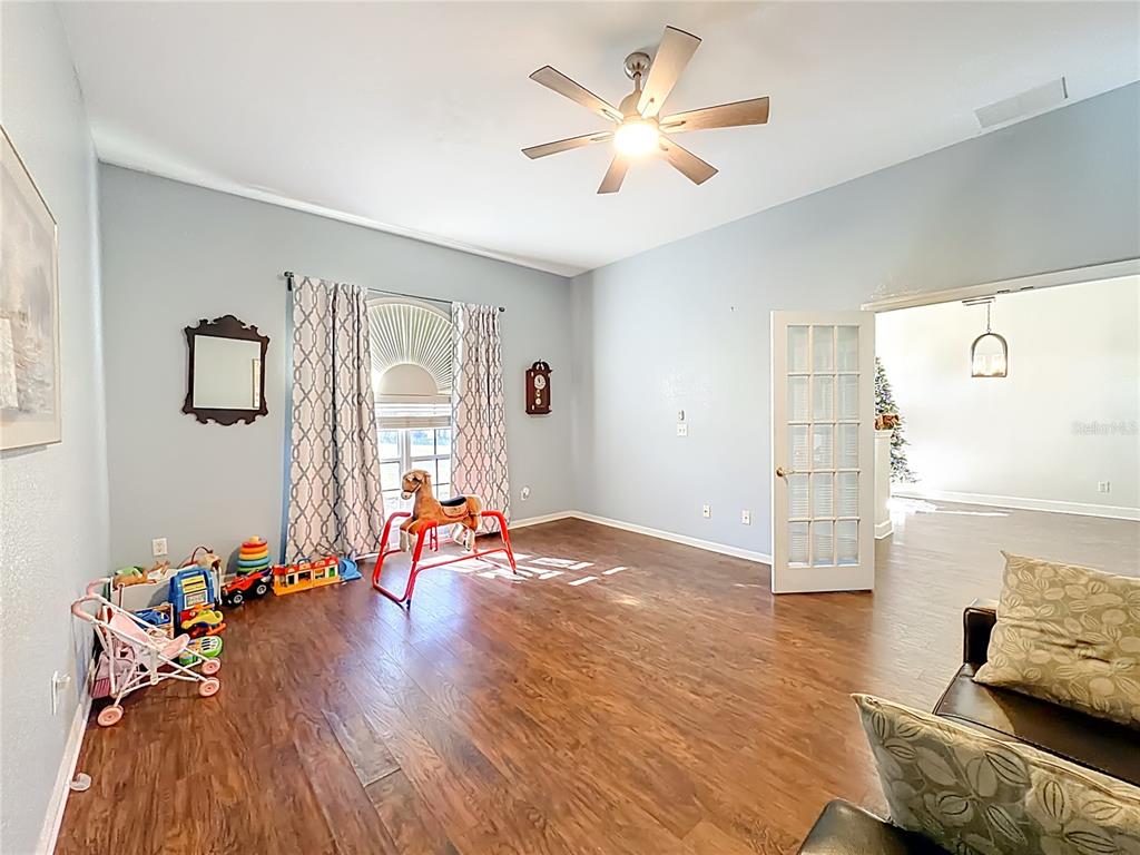 2301 Southeast 22nd Loop Ocala, FL 34471 - Photo 11 of 55 a living room with furniture and wooden floor