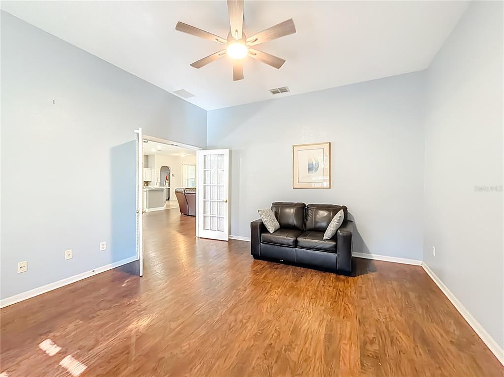 2301 Southeast 22nd Loop Ocala, FL 34471 - Photo 12 of 55 a living room with furniture and a wooden floor