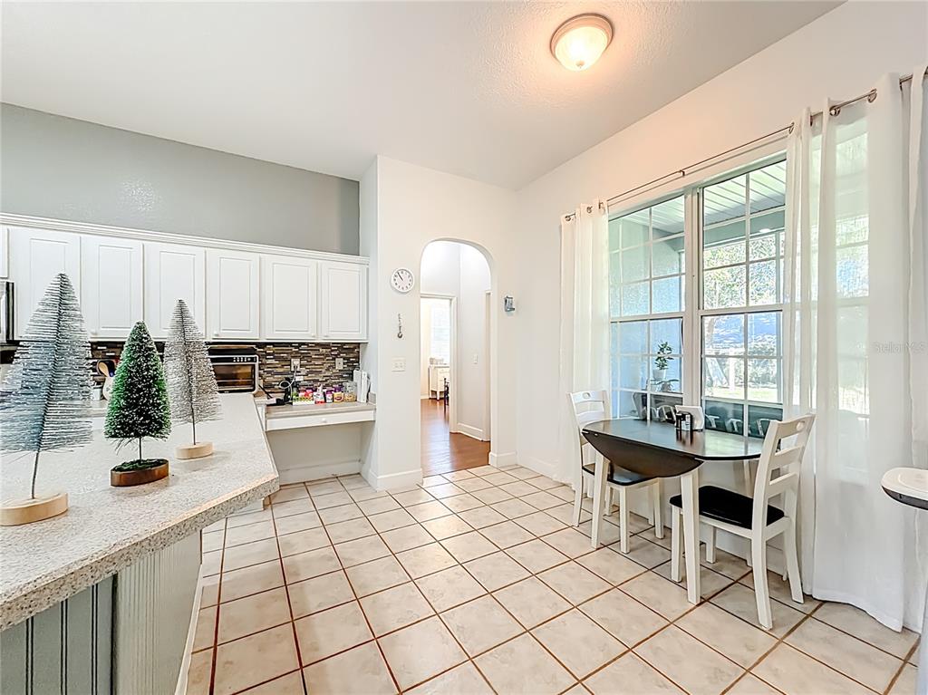 2301 Southeast 22nd Loop Ocala, FL 34471 - Photo 19 of 55 a living room with a sink furniture and a large window