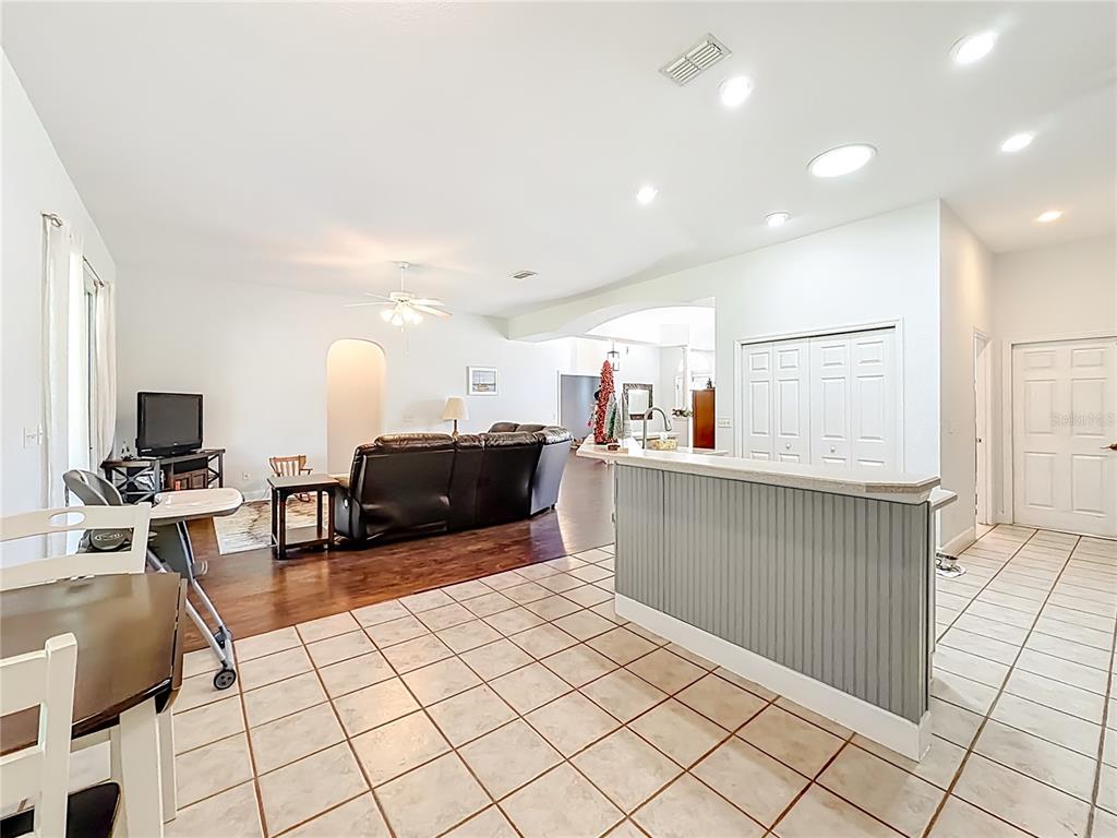2301 Southeast 22nd Loop Ocala, FL 34471 - Photo 21 of 55 a kitchen with stainless steel appliances kitchen island granite countertop a sink and cabinets