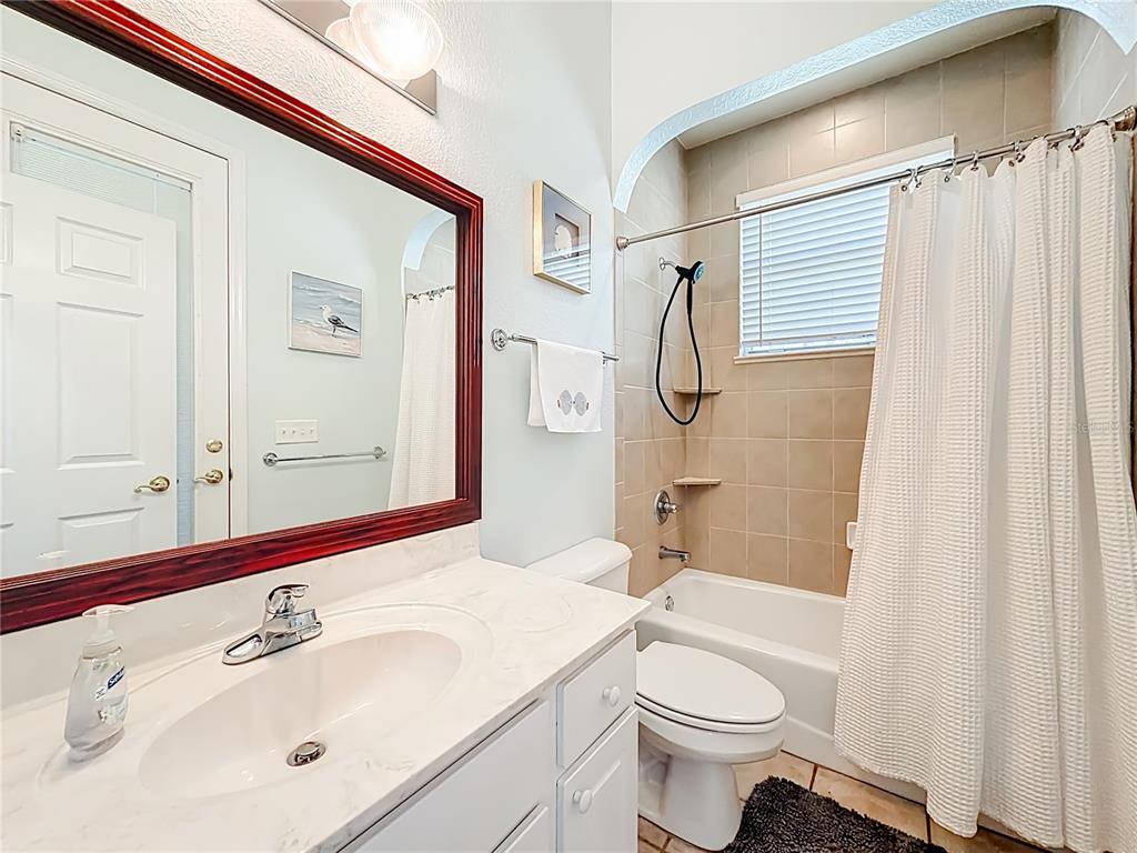 2301 Southeast 22nd Loop Ocala, FL 34471 - Photo 36 of 55 a bathroom with a sink a toilet and shower