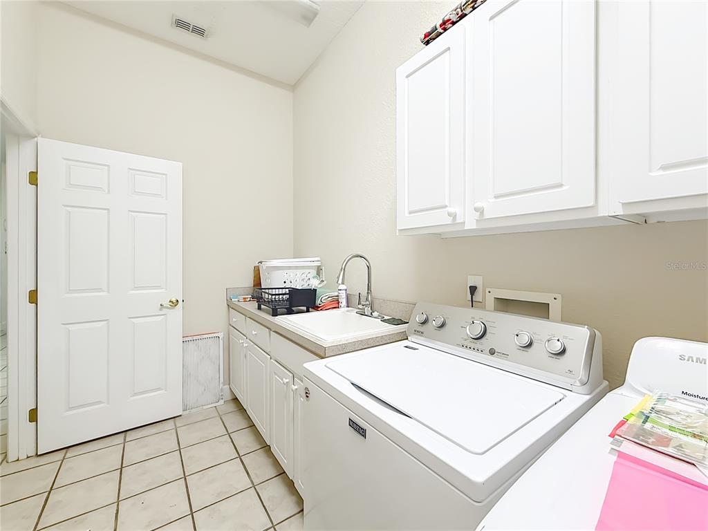 2301 Southeast 22nd Loop Ocala, FL 34471 - Photo 37 of 55 a utility room with dryer and washer