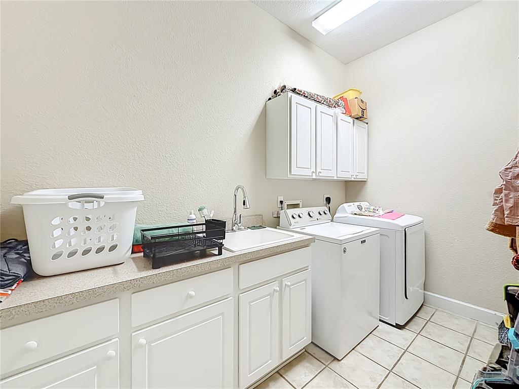 2301 Southeast 22nd Loop Ocala, FL 34471 - Photo 38 of 55 a utility room with sink dryer and washer