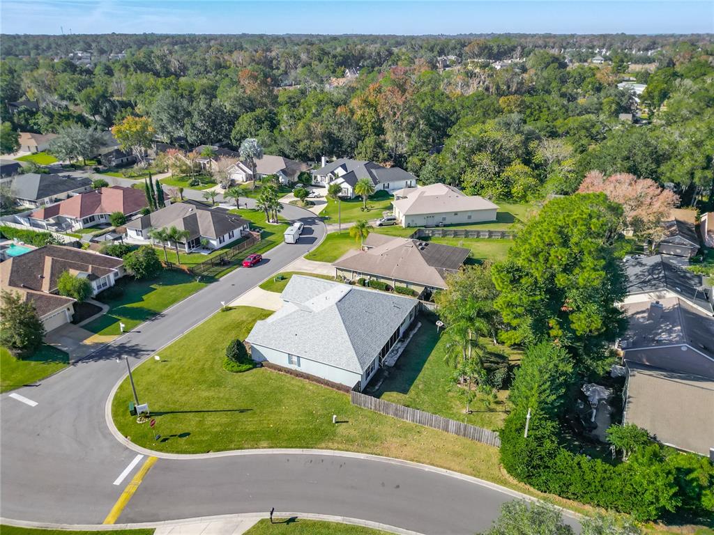 2301 Southeast 22nd Loop Ocala, FL 34471 - Photo 41 of 55 an aerial view of a house with a garden and swimming pool