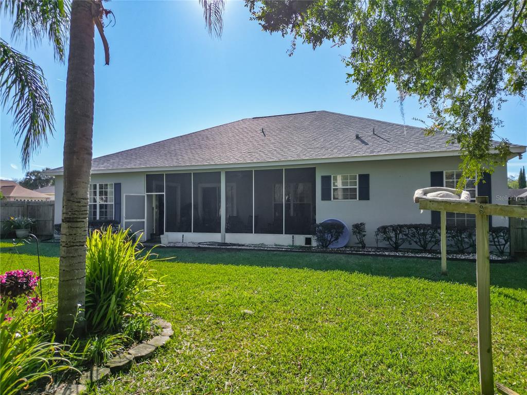 2301 Southeast 22nd Loop Ocala, FL 34471 - Photo 47 of 55 a front view of a house with a yard and porch
