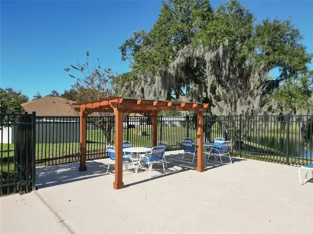 a view of a swimming pool with a yard
